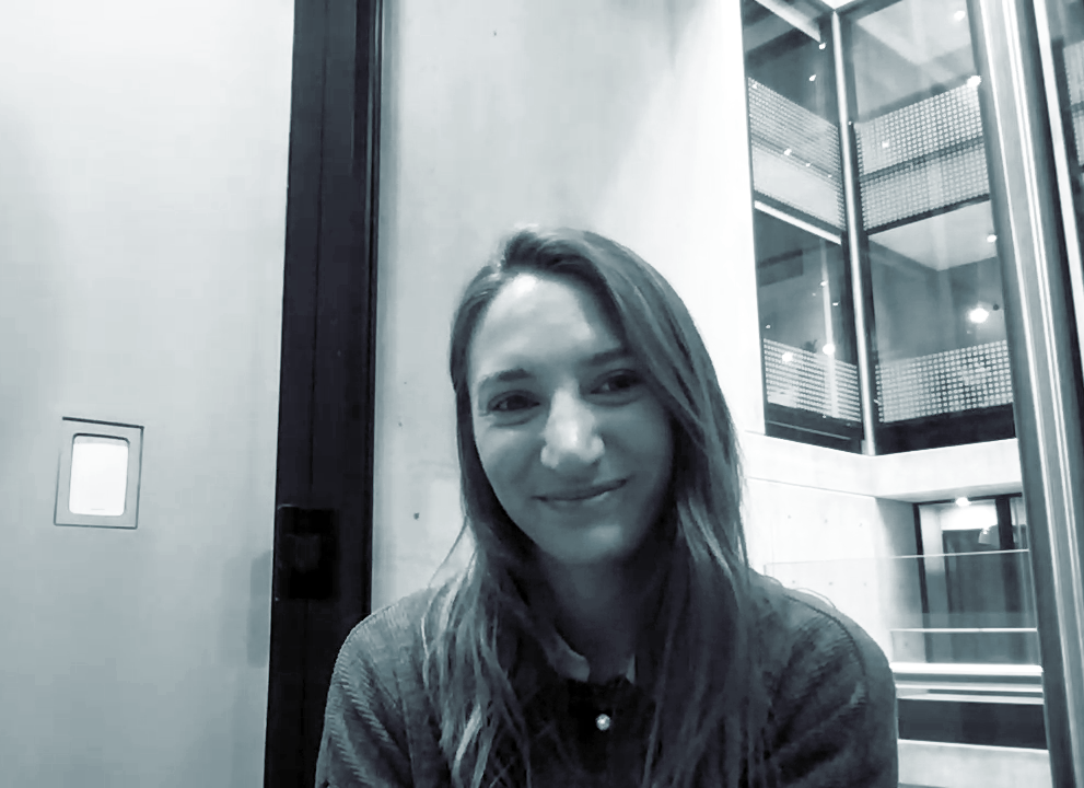 Black and white portrait photo of Jasmine Holdsworth. Still from Global Business Services Today video interview.